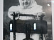 Фотография. Девочка в платье и платочке, стоящая на стуле. Фотограф: Лейцингер Я. И. Из фондов Вологодского музея-заповедника
