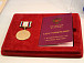 Памятная медаль «Патриот России» и удостоверение к ней