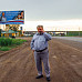 Анатолий Ехалов на фоне баннера по итогам проекта «Имя в культуре Вологодчины». Фото из личного архива